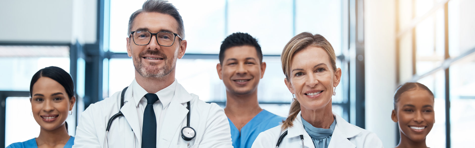 Doctors, nurses and team portrait in hospital, clinic or medical office. Teamwork, diversity and he